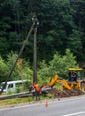 Builders installing new utility poles Royalty Free Stock Photo