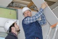 Builders making folding attic