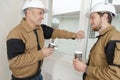 Builders relaxing during break on site Royalty Free Stock Photo