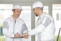 Builders relaxing during break on site Royalty Free Stock Photo