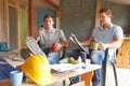 Builders Relaxing During Break On Site Royalty Free Stock Photo