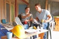 Builders Relaxing During Break On Site Royalty Free Stock Photo