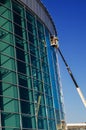 Builders repair facade on the crane