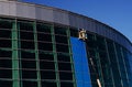 Builders repair facade on the crane