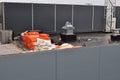 Builders rest after work on the roof of a building under construction