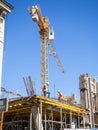 Builders on the roof of a house under construction. Construction industry. Workers at work. Construction of a new house