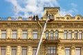 Builders on scaffolding for restoration ancient