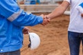 Builders shaking hands