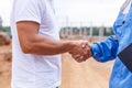 Builders shaking hands