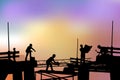 Builders silhouette at sunset