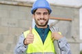 builders team leader showing thumb up