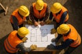 Builders view from above. Builders looking at a house plan. Royalty Free Stock Photo