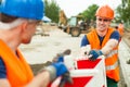 Builders working along