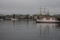 Buildigns of Aker Brigger, Oslo - cloudy evening and dark waters of the fjord. Royalty Free Stock Photo