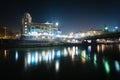 Building along the Danube Canal at night, in Vienna, Austria. Royalty Free Stock Photo