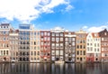 Building of apartment along river or canal for tourist, tour, cruise or ship transportation in Amsterdam in Netherlands Europe Royalty Free Stock Photo