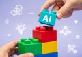 Building artificial intelligence concept with colorful blocks and related icons on a purple background Royalty Free Stock Photo