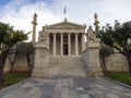 The building of the Athens Academy a marble column with a sculptures of Apollo and Athena, Socrates and Plato against a with cloud Royalty Free Stock Photo