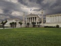 The building of the Athens Academy a marble column with a sculptures of Apollo and Athena, Socrates and Plato against a with