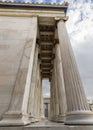 The building of the Athens Academy a marble column with a sculptures of Apollo and Athena, Socrates and Plato against a with