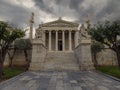 The building of the Athens Academy a marble column with a sculptures of Apollo and Athena, Socrates and Plato against a with