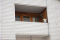 Building attic house construction with asbestos roof, cozy balcony and siding facade Royalty Free Stock Photo