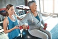 Building balance and strength for a better quality of life. a senior woman using weights and a fitness ball with the