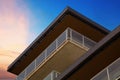 building with balcony corner on dramatic sky clouds sunset minimalist architecture Royalty Free Stock Photo