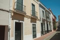 Building with balcony in quiet street of Merida