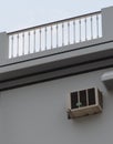 building, Balcony of a red yellow building with blue shutters and various vases