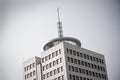 Building with big aerial on the roof Royalty Free Stock Photo