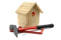 Building bird nesting box with hammer, nails and saw Royalty Free Stock Photo