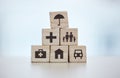 Building blocks, pyramid and life insurance for medical, car loan or home on background mockup, table or desk mock up