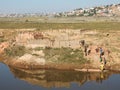 Madagascar, Building blocks, Stone stackers by transport boat, Antananarivo