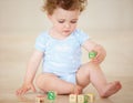 Building blocks to a bright future. Full length shot of a cute baby boy playing with toy blocks. Royalty Free Stock Photo