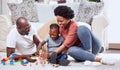 Building blocks, toys and black family playing on a living room floor happy, love and bonding in their home. Child Royalty Free Stock Photo