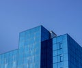 Building with blue windows against the blue sky Royalty Free Stock Photo