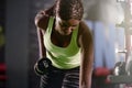 Building the body she deserves. a young woman lifting weights at the gym. Royalty Free Stock Photo