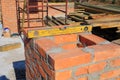 Building brick chimney on new house construction Royalty Free Stock Photo