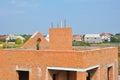 Building brick house construction incomplete roof top with chimney Royalty Free Stock Photo
