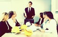 The construction manager speaks at a meeting in the office with workers Royalty Free Stock Photo