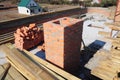 Building chimney from bricks. Bricklaying new house chimney