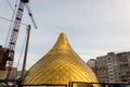 Building a church, consruction site. Golden dome of the Orthodox church in Central Russia on the blue sky background. Close up sho Royalty Free Stock Photo