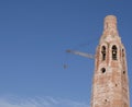 The building of the church. Elevating crane. Royalty Free Stock Photo