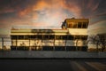 Building on Circuit Gilles-Villeneuve motor racing track at sunset