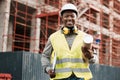 Building the city by hand. a male contractor holding a set of blue prints. Royalty Free Stock Photo