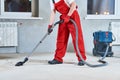 Building cleaning service. dust removal with vacuum cleaner Royalty Free Stock Photo