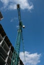 Building. Close-up of a construction crane against the blue sky Royalty Free Stock Photo