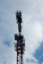 Building. Close-up of a construction crane against the blue sky Royalty Free Stock Photo