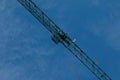 Building. Close-up of a construction crane against the blue sky Royalty Free Stock Photo